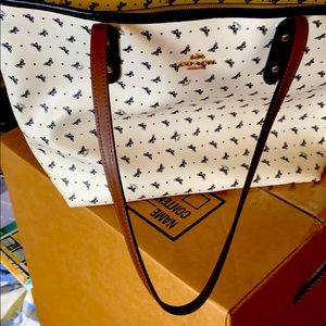 Coach black and beige purse.